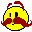 a yellow smiley face with a red nose