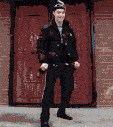 a man standing in front of a red door