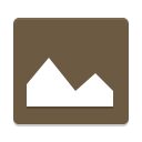a brown square with a white mountain on it