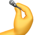a hand holding a microphone in it's left hand