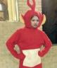 a person in a costume standing in a room