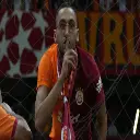 a man holding a soccer ball in his hand
