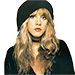 a woman with long hair wearing a black hat