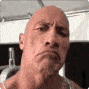 a man with a bald head wearing a tank top