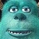 a close up of a green creature with horns