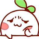 an apple with a sad face and a green leaf on top of it