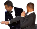 two men in tuxedos standing next to each other