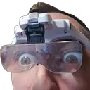 a man wearing a pair of glasses with a camera attached to his head