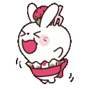 a white rabbit with a strawberry on its head