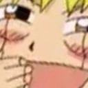 a close up of a person's face with yellow hair