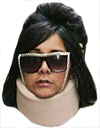 a picture of a woman wearing sunglasses and a scarf