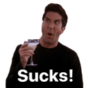 a man holding a martini glass with a surprised look on his face