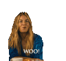 a woman sitting at a table with a tray of food