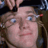 a woman getting her hair cut by a hair stylist