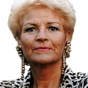 a woman with blonde hair wearing a leopard print jacket