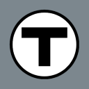 a black and white circle with the letter t in it