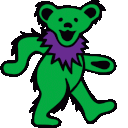 a green teddy bear with a purple bow around its neck