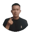 a man in a black shirt giving a thumbs up