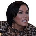a woman wearing a leopard print shirt and gold earrings
