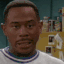 a man in a white shirt is looking at the camera