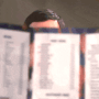 a blurry photo of a person reading a book