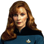 a woman with long red hair wearing a star trek uniform
