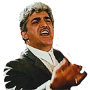 a man in a suit singing into a microphone