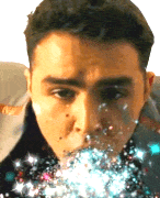 a man looking at the camera with a blurry background