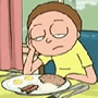 a person sitting at a table with a plate of food
