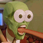 a man in a suit and tie with a green mask