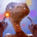 a close up of a stuffed animal with a light in its mouth