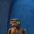 a blurry photo of a dummy in a blue room