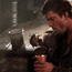 a blurry image of a man holding a cup of coffee