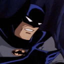 a man in a batman costume is smiling
