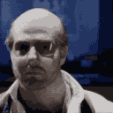 a man with glasses and a white shirt