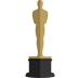 a golden statue on top of a black pedestal