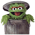 a sesame character in a bucket with a hat