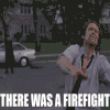 there is a man holding a gun in the street