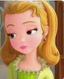 a girl in a green dress with a tiara