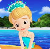 a girl in a blue dress sitting on a surfboard