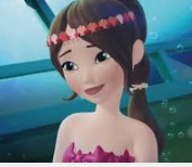 a girl in a pink dress with a flower in her hair