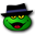 a green frog wearing a top hat