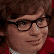 a man wearing glasses and a red jacket