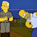 a man standing next to a man in a baseball uniform
