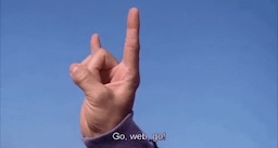 a person making a peace sign with their hand