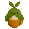 a green stuffed animal holding a cup of coffee