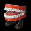 a red and white toothbrush sitting on top of a black surface