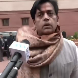a man wearing a scarf and a scarf around his neck