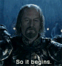 a man with long hair and a beard wearing armor