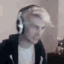 a blurry photo of a person wearing headphones